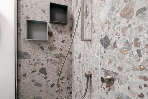 Koupelna v ubytování Casa Lugana 20 - monolocale con piscina fronte lago