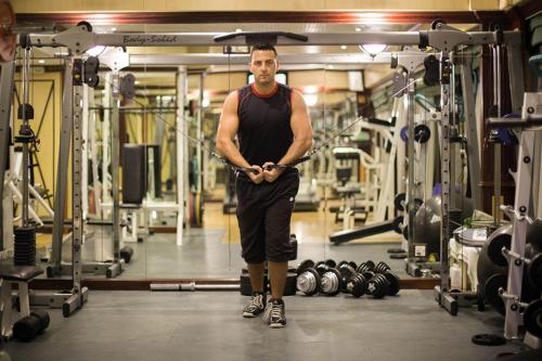 a man is standing in a gym at Capitol Hotel Jumeirah Dubai in Dubai