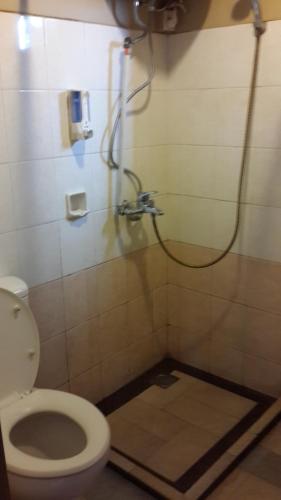 a bathroom with a toilet and a shower at Apartemen Mediterania Palace Residence Kemayoran Jakarta Pusat in Jakarta