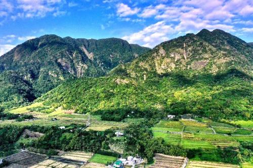 a view of a mountain with houses and trees at 6號交響曲民宿 in Chenggong