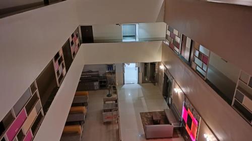 an overhead view of a hallway in a building at Hotel Sai Nidhi Executive-MindSpace Airoli Navi Mumbai in Navi Mumbai