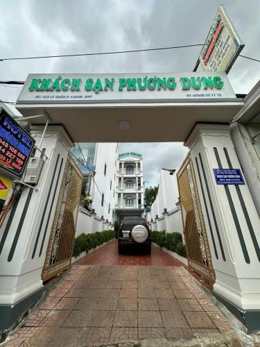 a car is parked under a car parking garage at Phuong Dung Hotel in Buon Ma Thuot