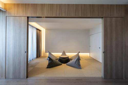 two pillows sitting on the floor in a room at seven x seven Itoshima in Itoshima