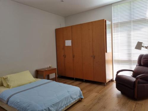 Ένα ή περισσότερα κρεβάτια σε δωμάτιο στο Villa Syariah Bandung Banget