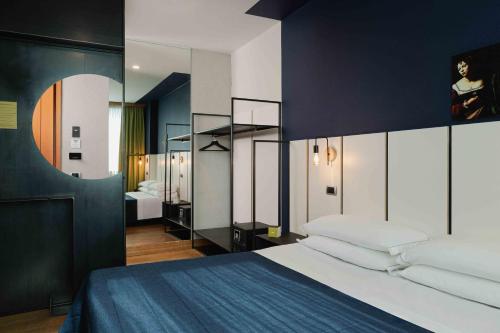 Postel nebo postele na pokoji v ubytování Garda Hotel