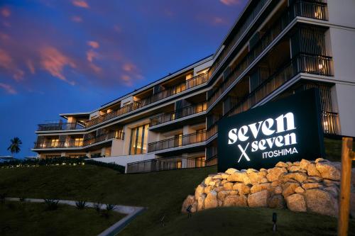 a building with a sign in front of it at seven x seven Itoshima in Itoshima