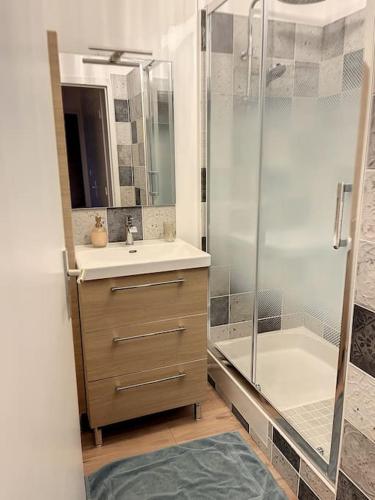 a bathroom with a shower and a sink and a tub at Le Julia - Neuf - Gare et garage in Compiègne