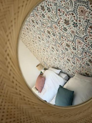 a circular view of a bedroom with pillows at Le Julia - Neuf - Gare et garage in Compiègne