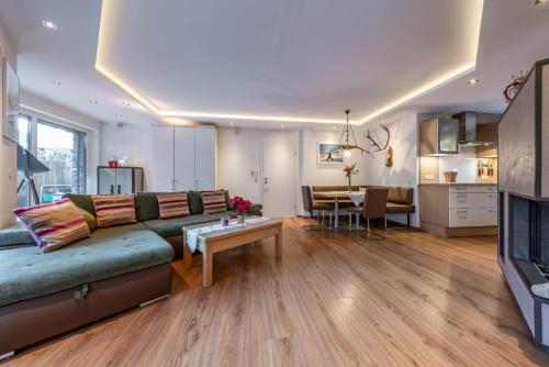 a living room with a couch and a table at Chalet Perauer in Mayrhofen