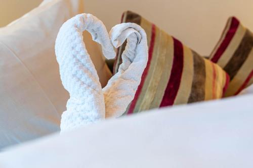 a pair of towels laying on a bed at Chalet Perauer in Mayrhofen