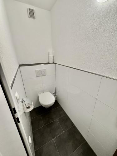 a small bathroom with a toilet in a stall at Felbermayer Appartements in Gaschurn