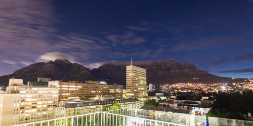 a view of a city with a mountain in the background at Habitat Aparthotel by Totalstay in Cape Town