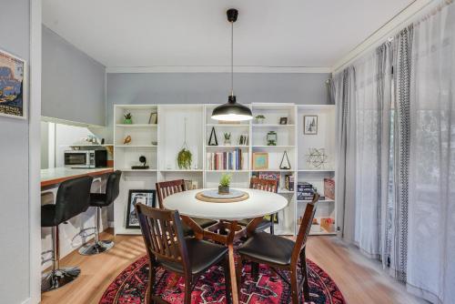 a dining room with a table and chairs at Cozy Nest Condo in Welches in Mount Hood Village