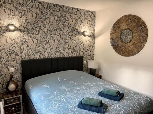 Katil atau katil-katil dalam bilik di *Rivage* Spacieux T2 RDC sur cour:Jardin-Fibre-Netflix-Terrasse