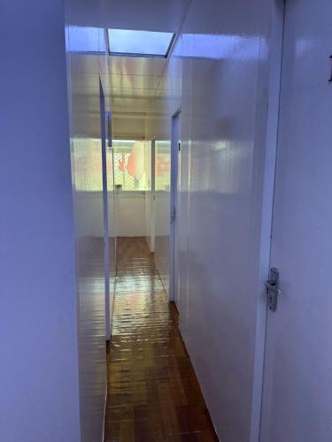 an empty hallway with a door leading to a room at Decent UNISEX Private Rooms near Burjuman Metro Exit -4 in Dubai