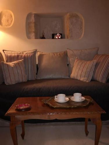 a living room with a couch with a coffee table at Casa Opuntia in Pappayiannádhes