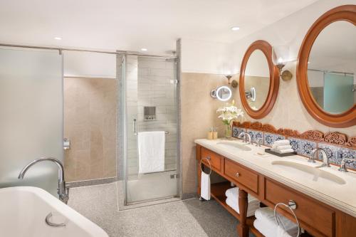 a bathroom with a sink and a shower at Taj Exotica Resort & Spa, Goa in Benaulim
