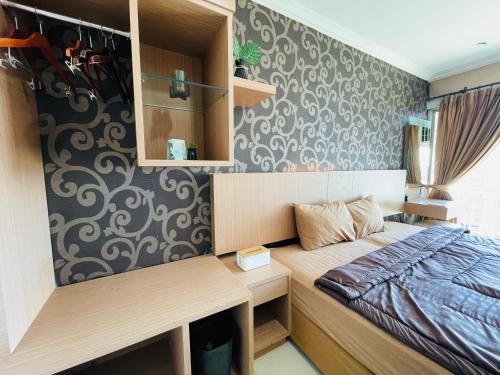 Ένα ή περισσότερα κρεβάτια σε δωμάτιο στο Superior Room At Galeri Ciumbuleuit 1st Tower with Best View
