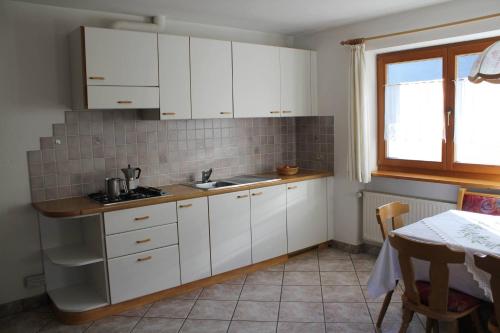 Η κουζίνα ή μικρή κουζίνα στο Planhof Apartments