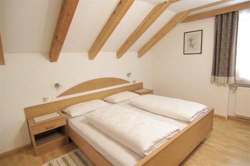 Ένα ή περισσότερα κρεβάτια σε δωμάτιο στο Planhof Apartments