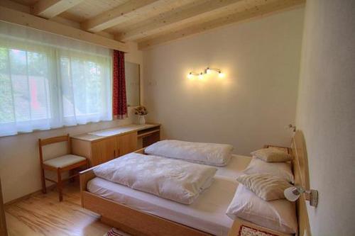 Ένα ή περισσότερα κρεβάτια σε δωμάτιο στο Planhof Apartments