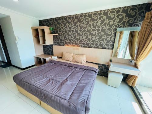 Ένα ή περισσότερα κρεβάτια σε δωμάτιο στο Superior Room At Galeri Ciumbuleuit 1st Tower with Best View