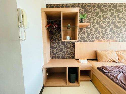 Ένα ή περισσότερα κρεβάτια σε δωμάτιο στο Superior Room At Galeri Ciumbuleuit 1st Tower with Best View
