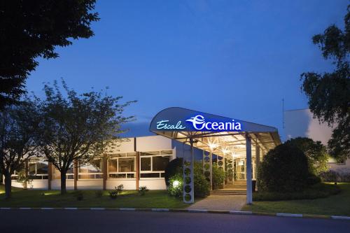 a building with a sign on the front of it at Escale Oceania Brest in Gouesnou