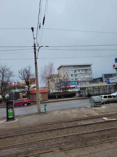 a street with cars parked on the side of the road at Квартира- студия возле метро Академика Павлова in Kharkiv