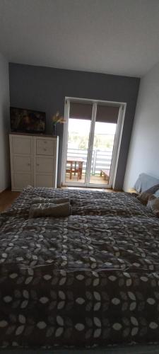 Postel nebo postele na pokoji v ubytování Onix-Vital Apartman Orfű