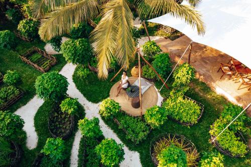an aerial view of a garden with a statue of a horse at Ycona Eco-Luxury Resort, Zanzibar in Dikoni