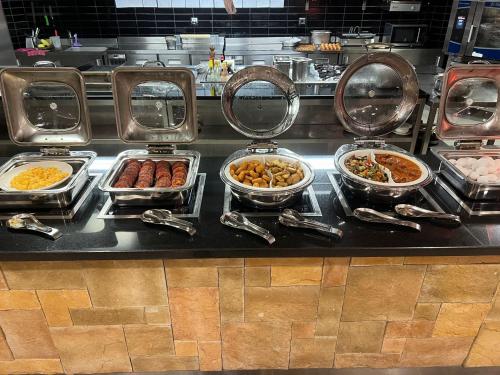 a buffet line with many different types of food at Hilton Garden Inn Corlu in Corlu