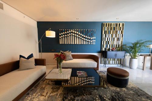a living room with a couch and a table at Hyatt Regency Cape Town in Cape Town