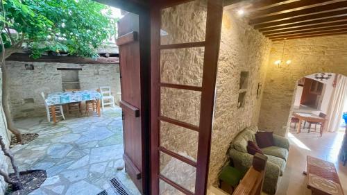 a door leading into a room with a patio at Juliet Suite by TrulyCyprus in Doros