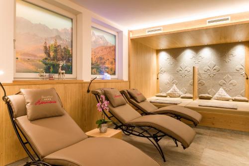 a spa room with four chairs and two beds at Ferienschlössl Harmonie in Holzgau