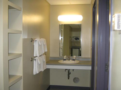 a bathroom with a sink and a mirror at UPEI Summer Accommodations in Charlottetown