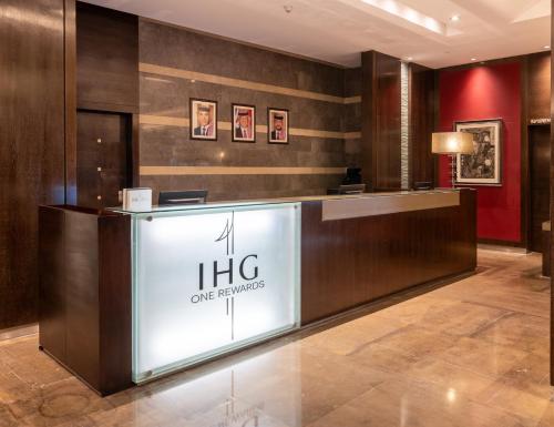 a lobby of a hotel with a reception desk at Crowne Plaza Amman by IHG in Amman