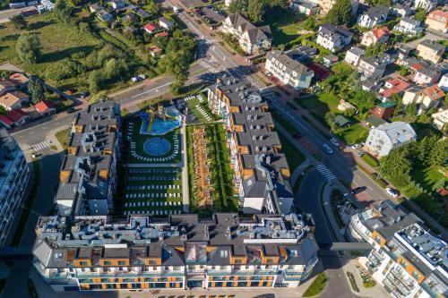 an aerial view of a building in a city at Sunny Apartments in Bel Mare Resort by Renters in Międzyzdroje