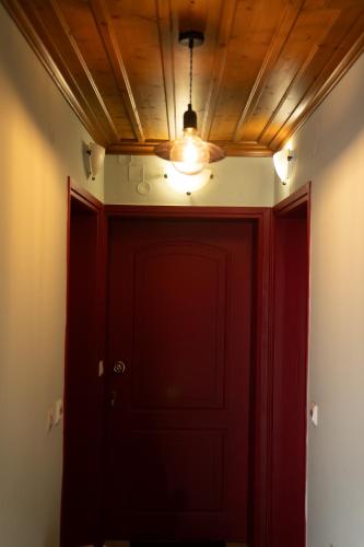 a room with a red door and a ceiling at Delphian Colors - Red Edition in Delfoi