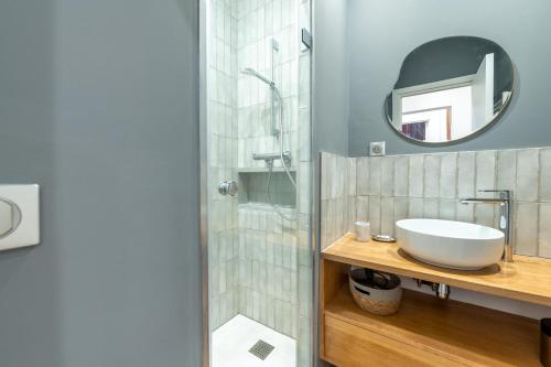 a bathroom with a sink and a mirror at Sweet Home Brevent - Happy Rentals in Chamonix