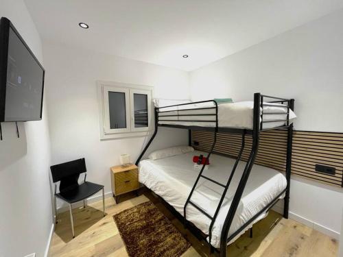 Poschodová posteľ alebo postele v izbe v ubytovaní Refugio alpino a 5 min de pistas