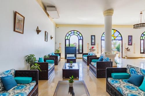 a living room with couches and a tv at Daniela Diving Resort Dahab in Dahab
