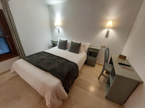 a hotel room with a bed and a desk at My Rooms Manacor Centre by My Rooms Hotels in Manacor