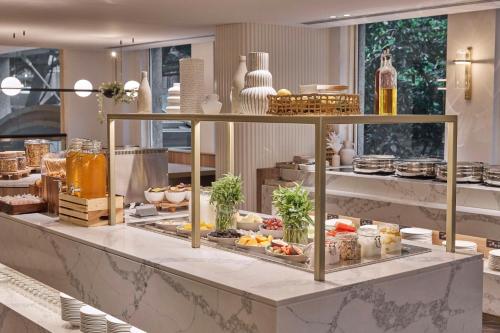 a buffet with many different types of food on display at Rydges Darling Square Apartment Hotel in Sydney