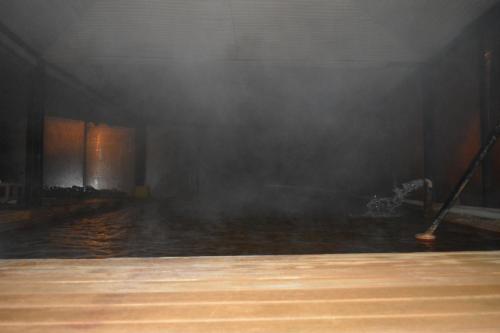 a room filled with water with smoke coming out of it at Oskar Thermal Hotel in Pamukkale