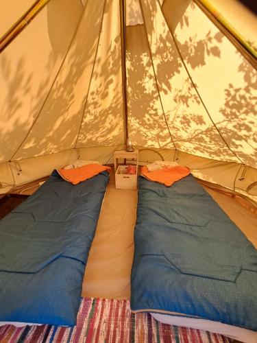 a tent with two sleeping bags in it at Camping 3 Gs in Goghtʼ