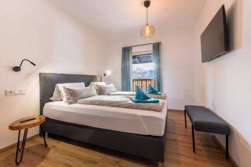Postel nebo postele na pokoji v ubytování Appartements Uribi mit eigener Sauna by Schladmingurlaub