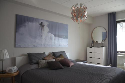 a bedroom with a bed with a teddy bear on it at SeaSide in Sipplingen