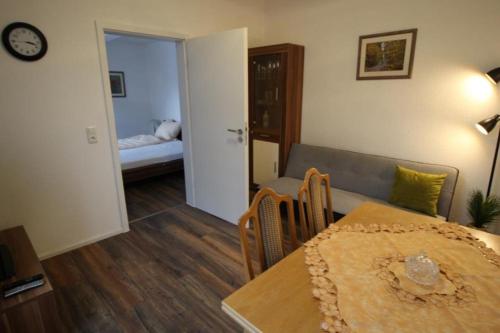 a living room with a table and a couch at NEU! FeWo Winkeleck in Alsfeld
