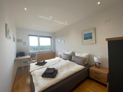 En eller flere senge i et værelse på Premium Apartment Hägerstraße